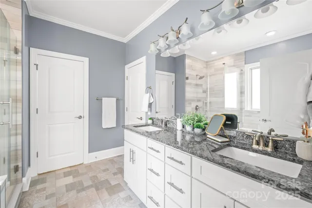 a bathroom with a bathtub and shower