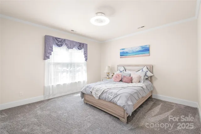 a bathroom with a granite countertop double vanity sink a mirror and shower