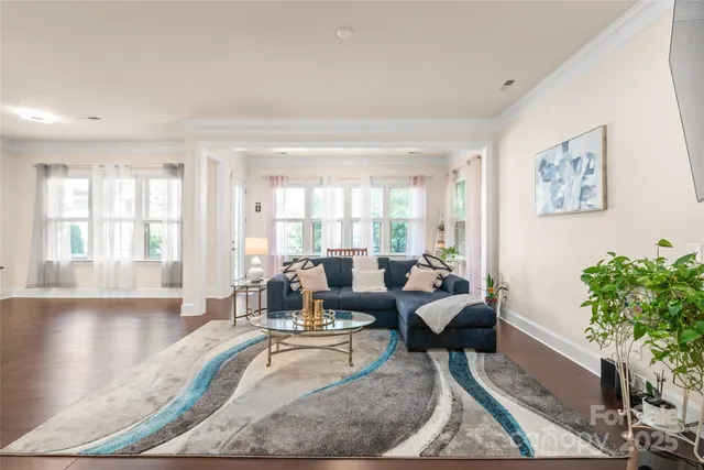 a kitchen with granite countertop a stove a sink and a refrigerator