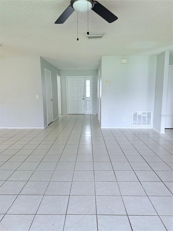 1636 Baker Road Lutz, FL 33559 - Photo 3 of 13 a view of an empty room with a window