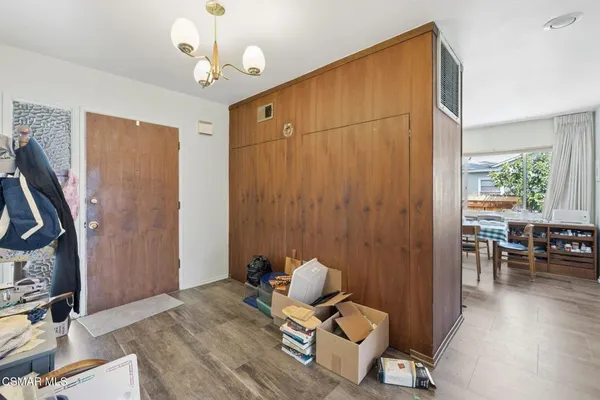 a view of a livingroom with furniture and hardwood floor