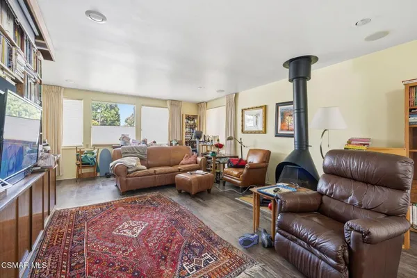 a living room with furniture or couch and a large window