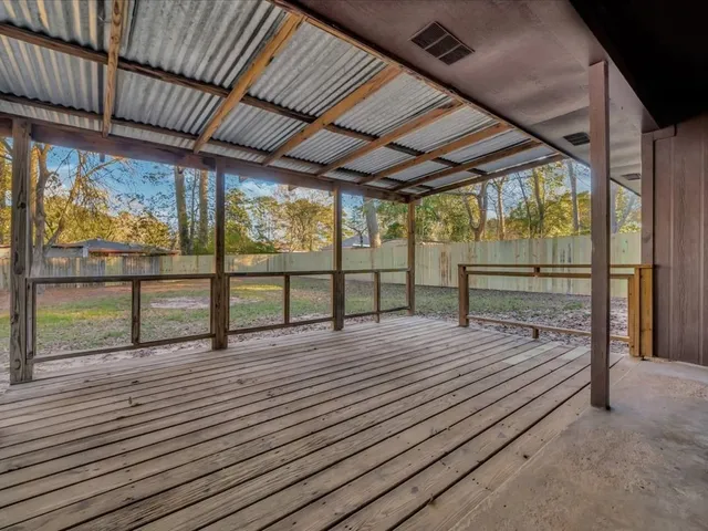 a view of outdoor space with wooden floor