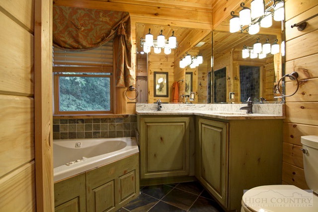 238 Knob Hill Road Boone, NC 28607 - Photo 3 of 25 a bathroom with a sink toilet and shower