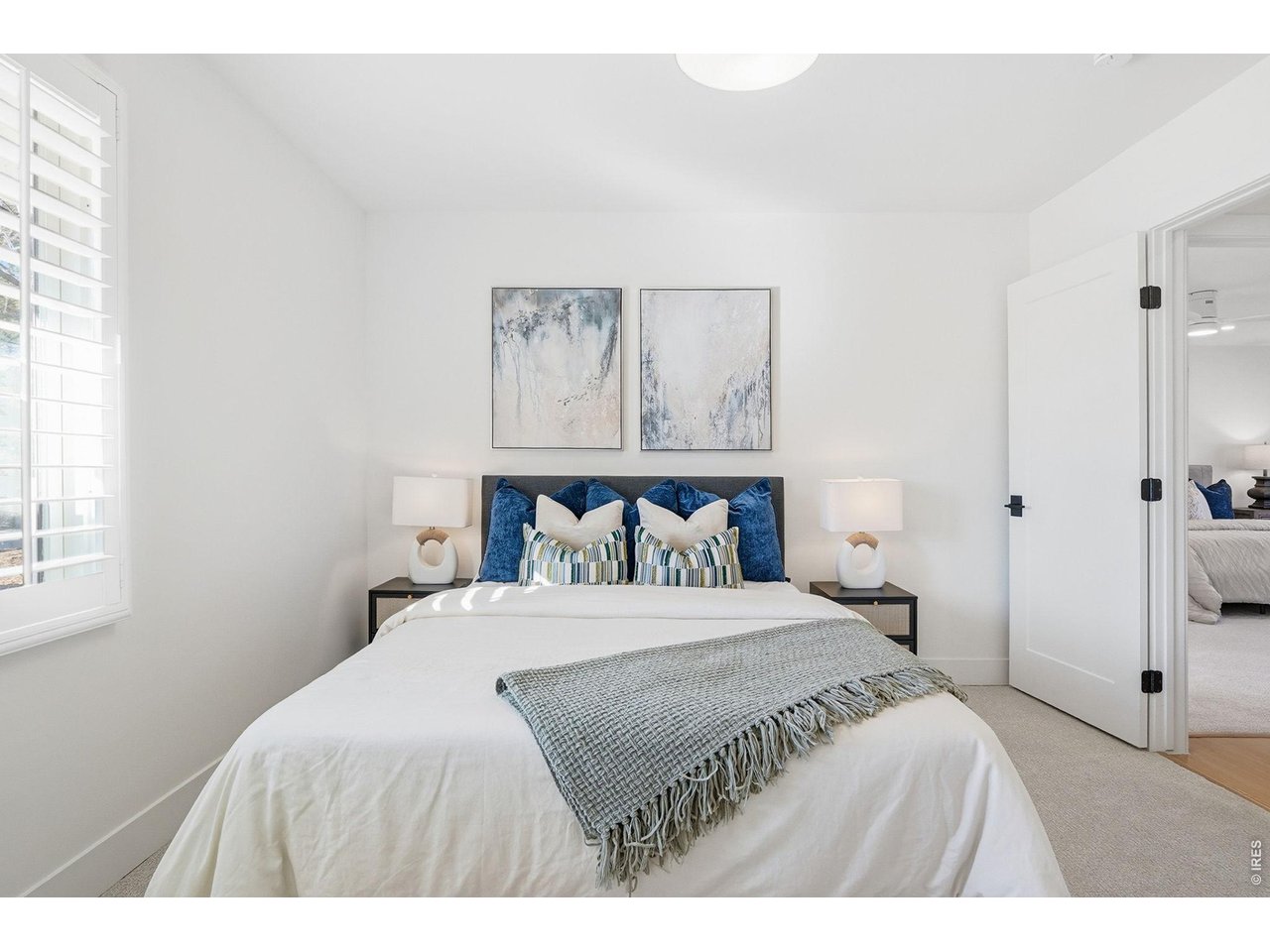 4788 Briar Ridge Trail Boulder, CO 80301 - Photo 23 of 45 Spacious secondary bedroom located on the main level, featuring ample natural light and versatile living space.