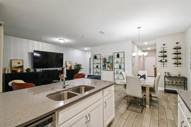 a kitchen with a sink and a refrigerator