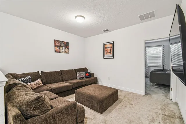 a living room with furniture and a couch