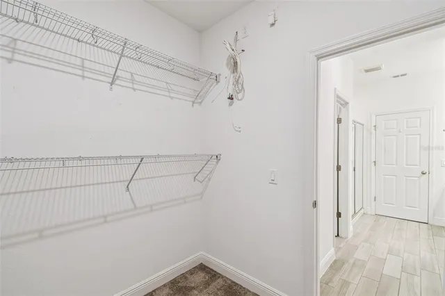 a view of a room with racks on the wall