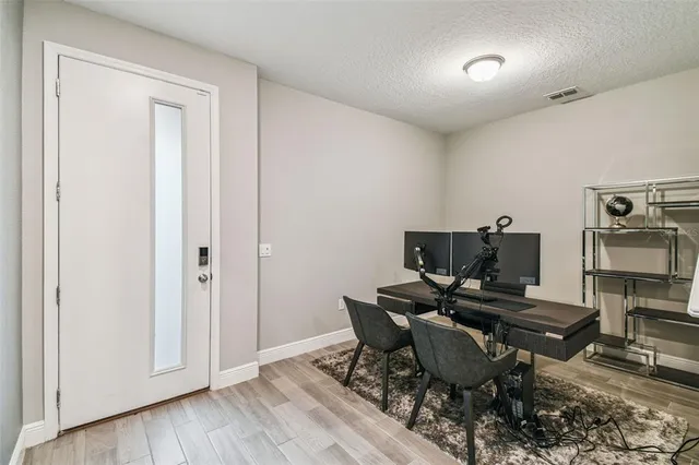 a workspace with furniture and a window