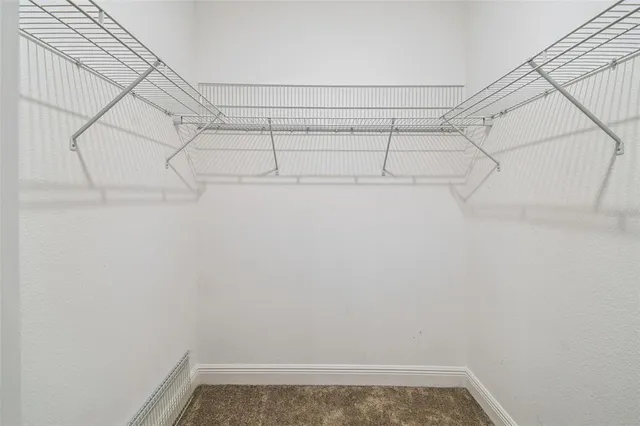 a view of a room with racks on the wall