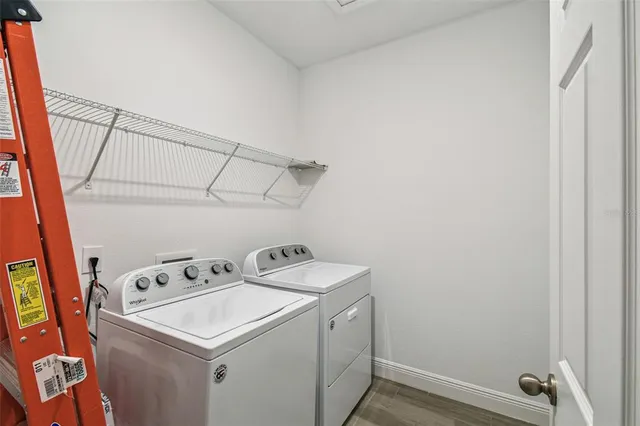 a utility room with dryer and washer