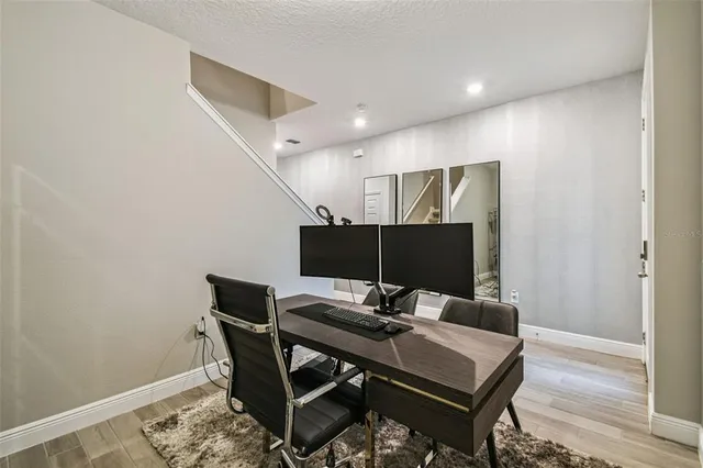 a view of a workspace with furniture