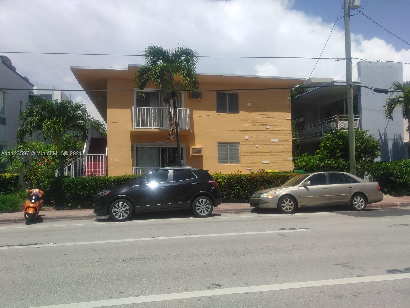 7720 Harding Avenue, Unit 1 Miami Beach, FL 33141 - Photo 2 of 7 a view of a car parked in front of a house