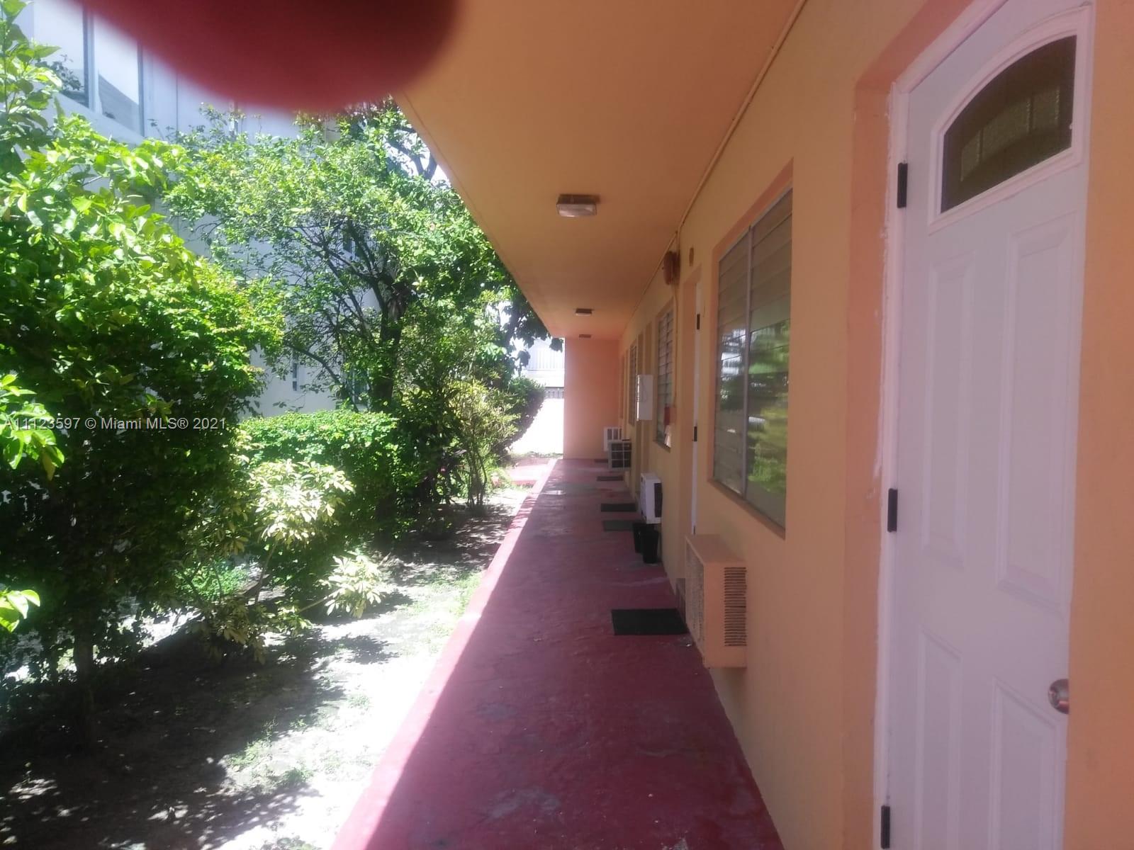 7720 Harding Avenue, Unit 1 Miami Beach, FL 33141 - Photo 7 of 7 a view of a pathway