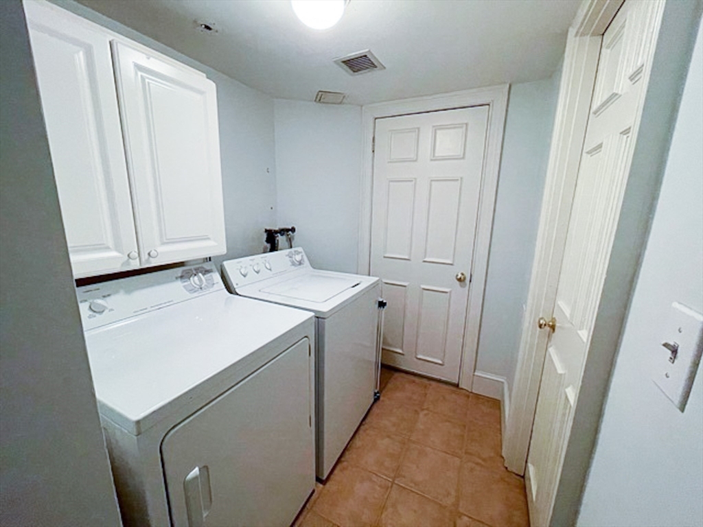 57 Dwight Street, Unit G Boston, MA 02118 - Photo 15 of 28 a utility room with dryer and washer