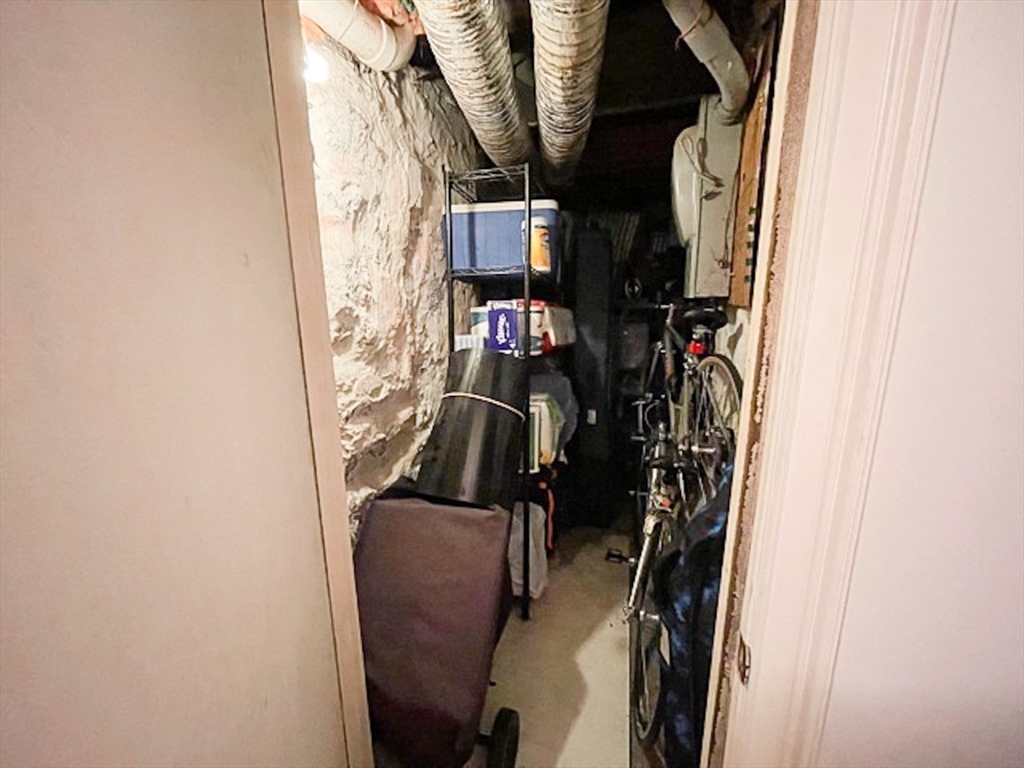 57 Dwight Street, Unit G Boston, MA 02118 - Photo 17 of 28 a view of walk in closet with clothes