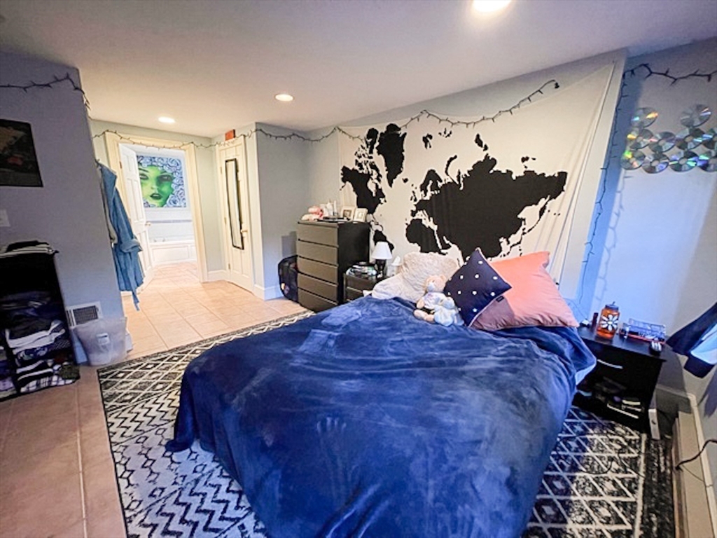 57 Dwight Street, Unit G Boston, MA 02118 - Photo 19 of 28 a bed room with a bed and a television