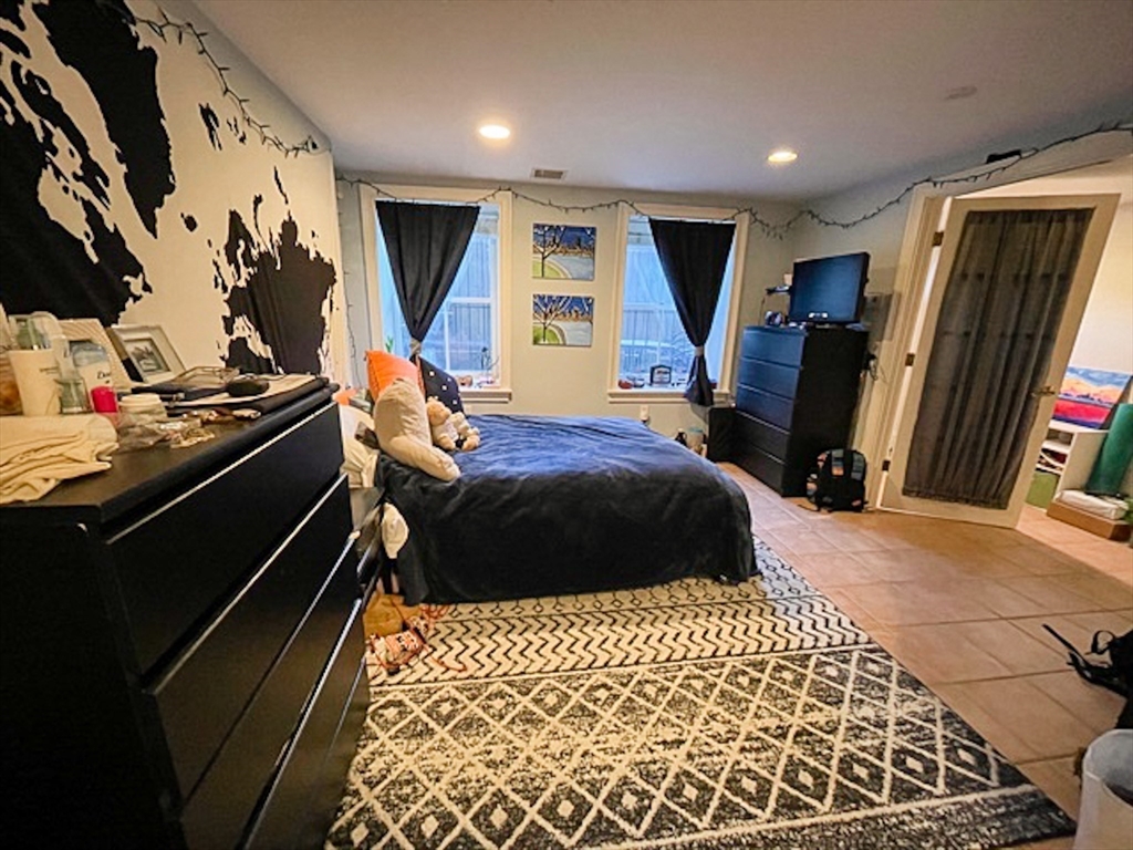 57 Dwight Street, Unit G Boston, MA 02118 - Photo 20 of 28 a bedroom with a bed and a dresser