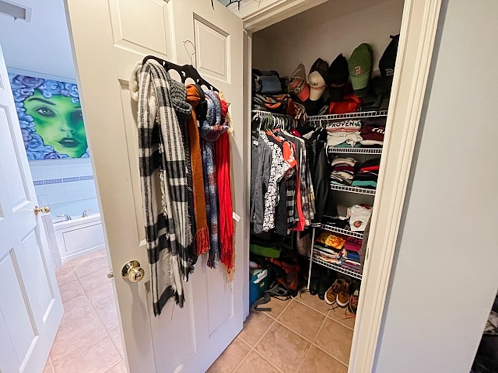 57 Dwight Street, Unit G Boston, MA 02118 - Photo 23 of 28 a view of walk in closet with clothes