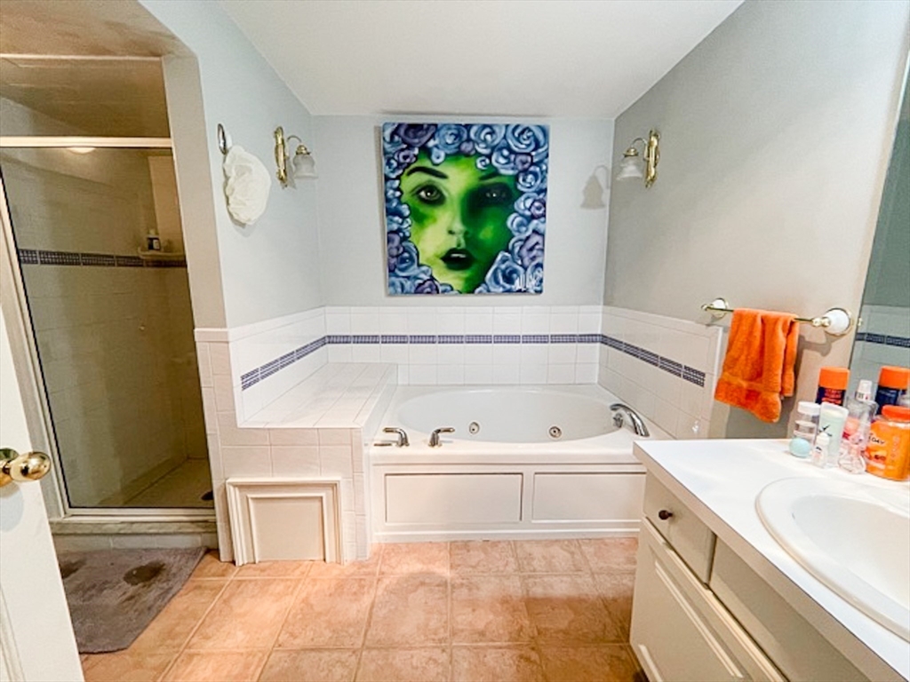 57 Dwight Street, Unit G Boston, MA 02118 - Photo 25 of 28 a bathroom with a tub sink and a shower
