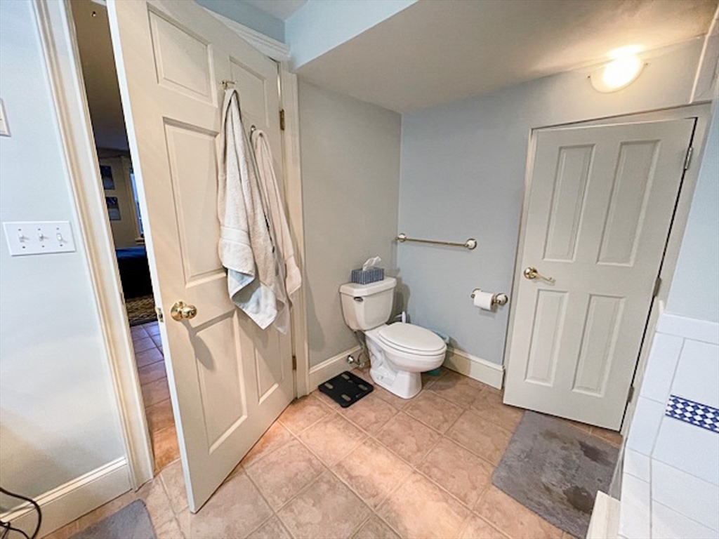 57 Dwight Street, Unit G Boston, MA 02118 - Photo 26 of 28 a large white room with a toilet