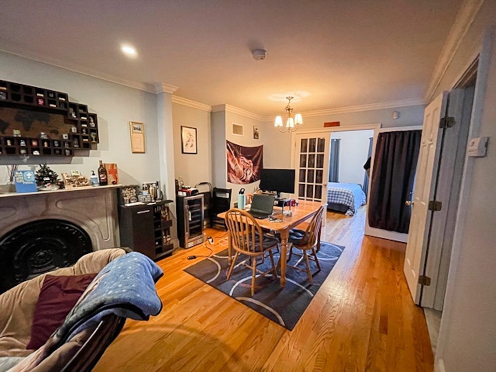 57 Dwight Street, Unit G Boston, MA 02118 - Photo 3 of 28 a living room with furniture and a flat screen tv