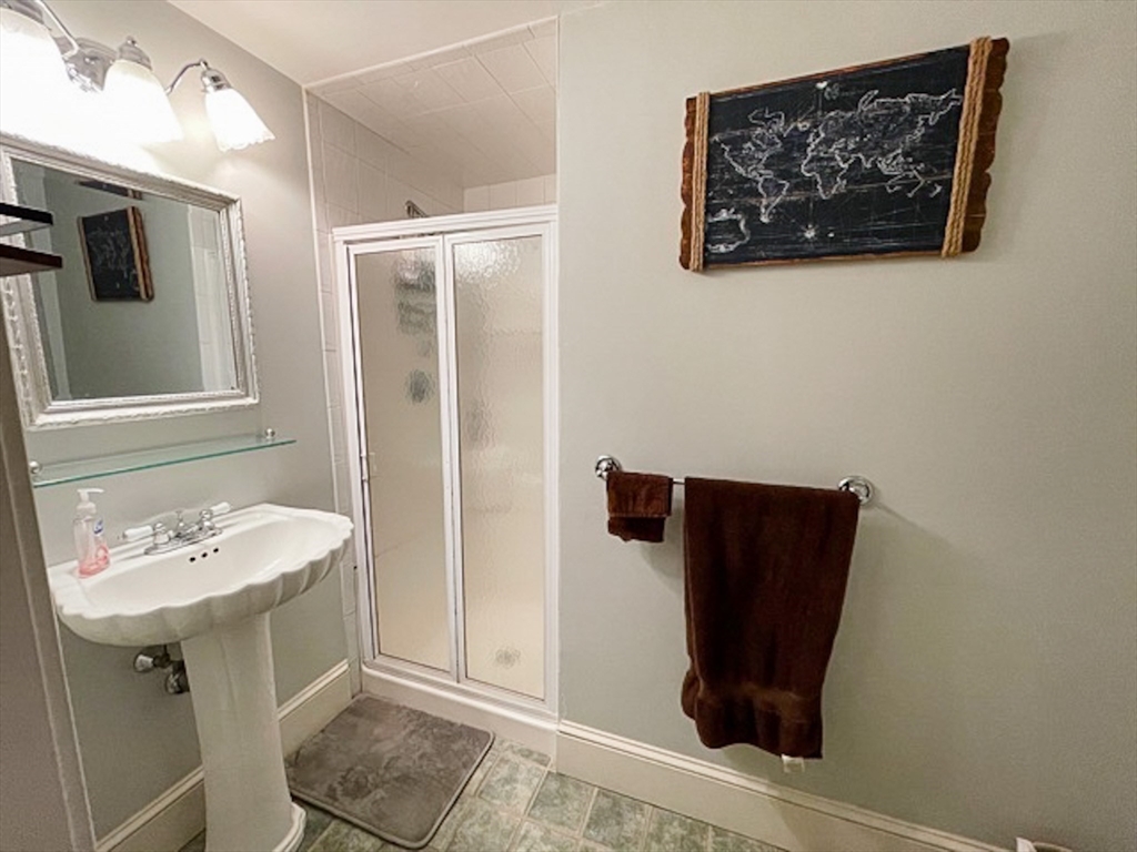 57 Dwight Street, Unit G Boston, MA 02118 - Photo 10 of 28 a bathroom with a sink and a mirror