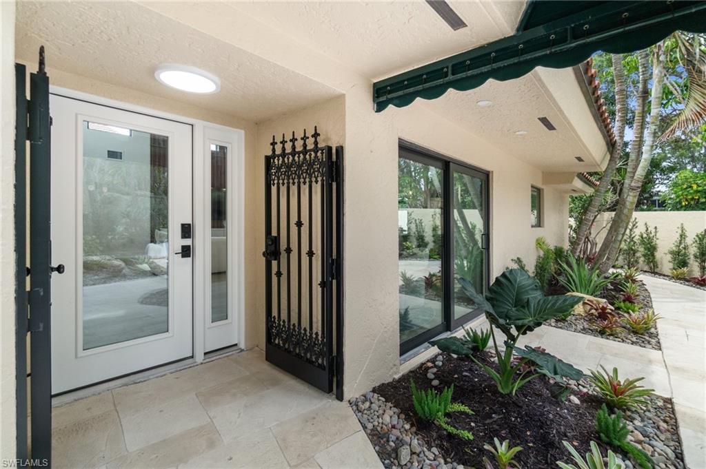 6804 Sand Pointe Circle Naples, FL 34108 - Photo 12 of 49 A brand new hurricane grade front door for added security