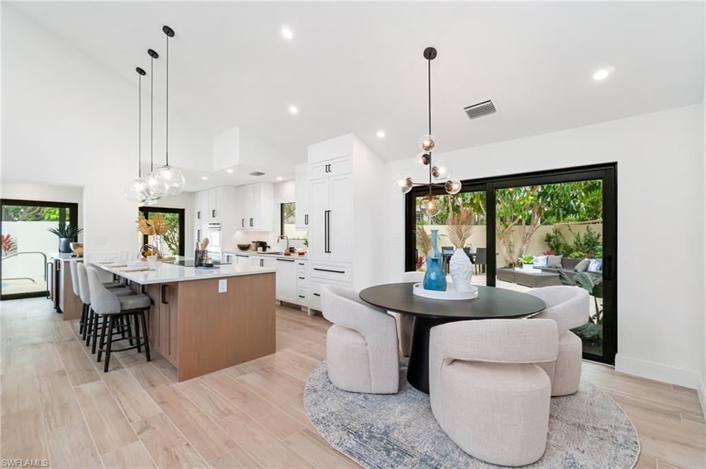 6804 Sand Pointe Circle Naples, FL 34108 - Photo 49 of 49 The kitchen has been redesigned - opening the floor plan - uniting the living and dining spaces