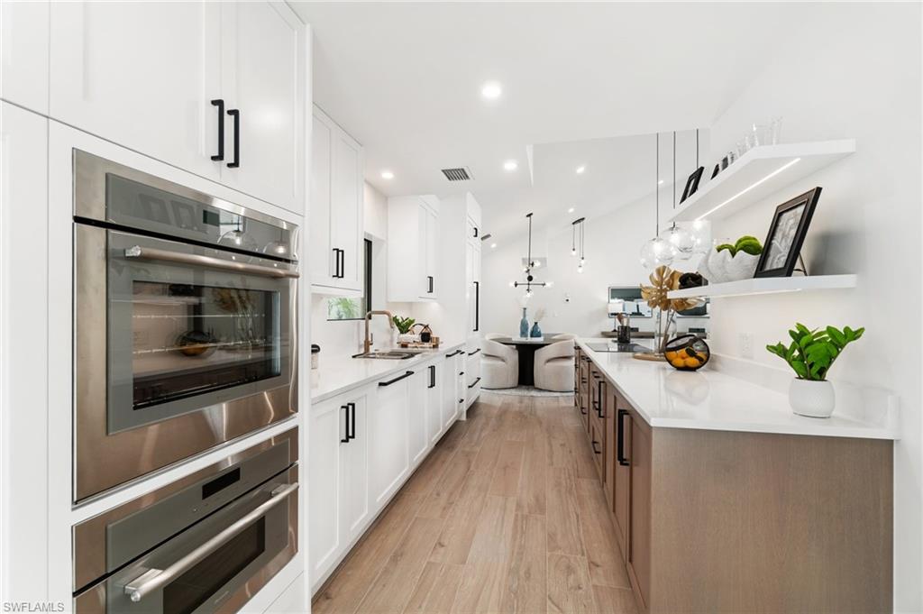 6804 Sand Pointe Circle Naples, FL 34108 - Photo 19 of 49 Shaker cabinets with soft-close doors and drawers, quartz counters