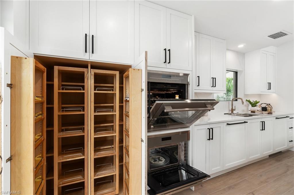 6804 Sand Pointe Circle Naples, FL 34108 - Photo 21 of 49 Wood pantry built-ins, with Shaker front