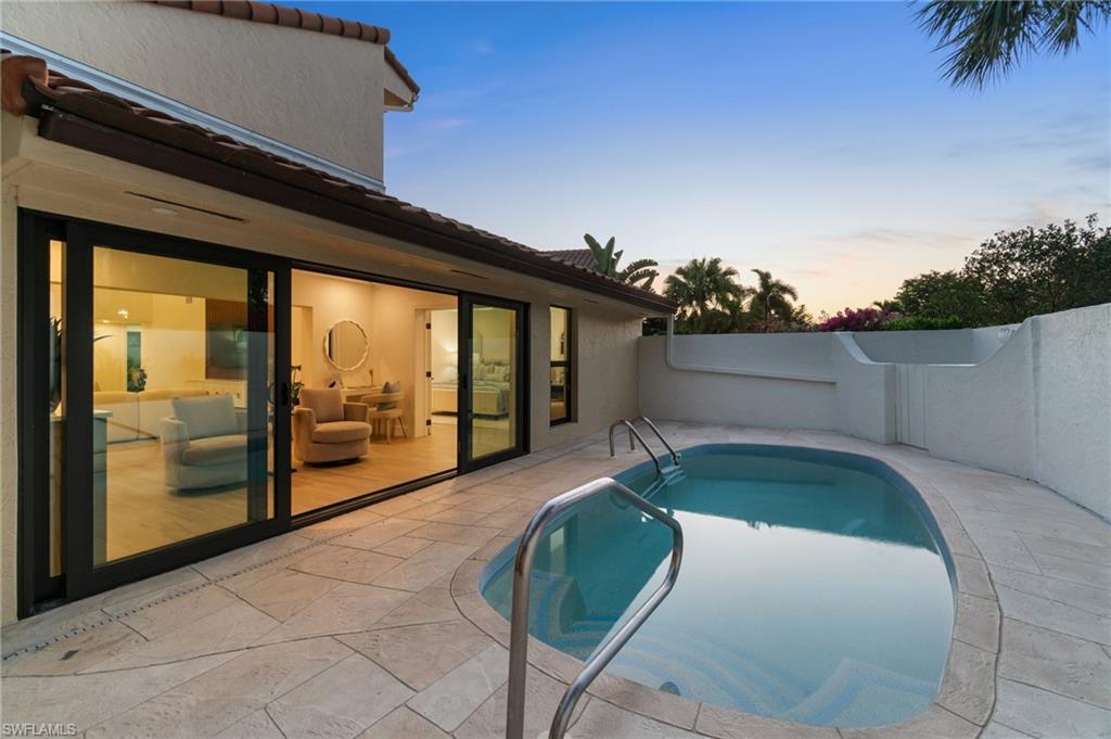 6804 Sand Pointe Circle Naples, FL 34108 - Photo 5 of 49 Pool with new glass stone coping, and freshly painted pool deck