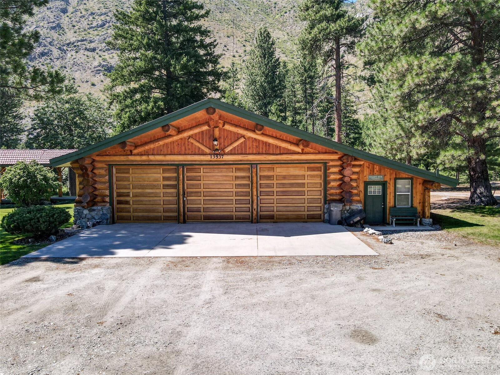 13537 Entiat River Road Entiat, WA 98822 - Photo 31 of 40 a front view of a house with a yard and garage