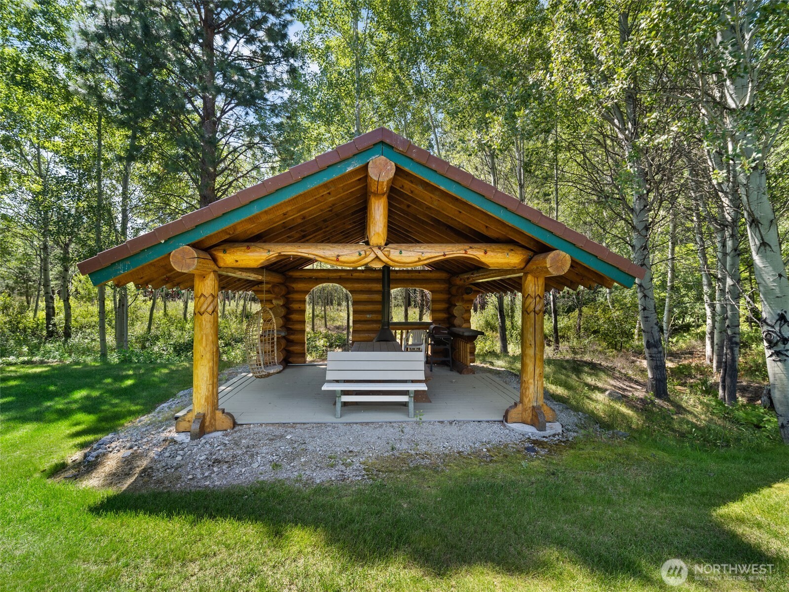 13537 Entiat River Road Entiat, WA 98822 - Photo 32 of 40 a backyard of a house with barbeque oven table and chairs