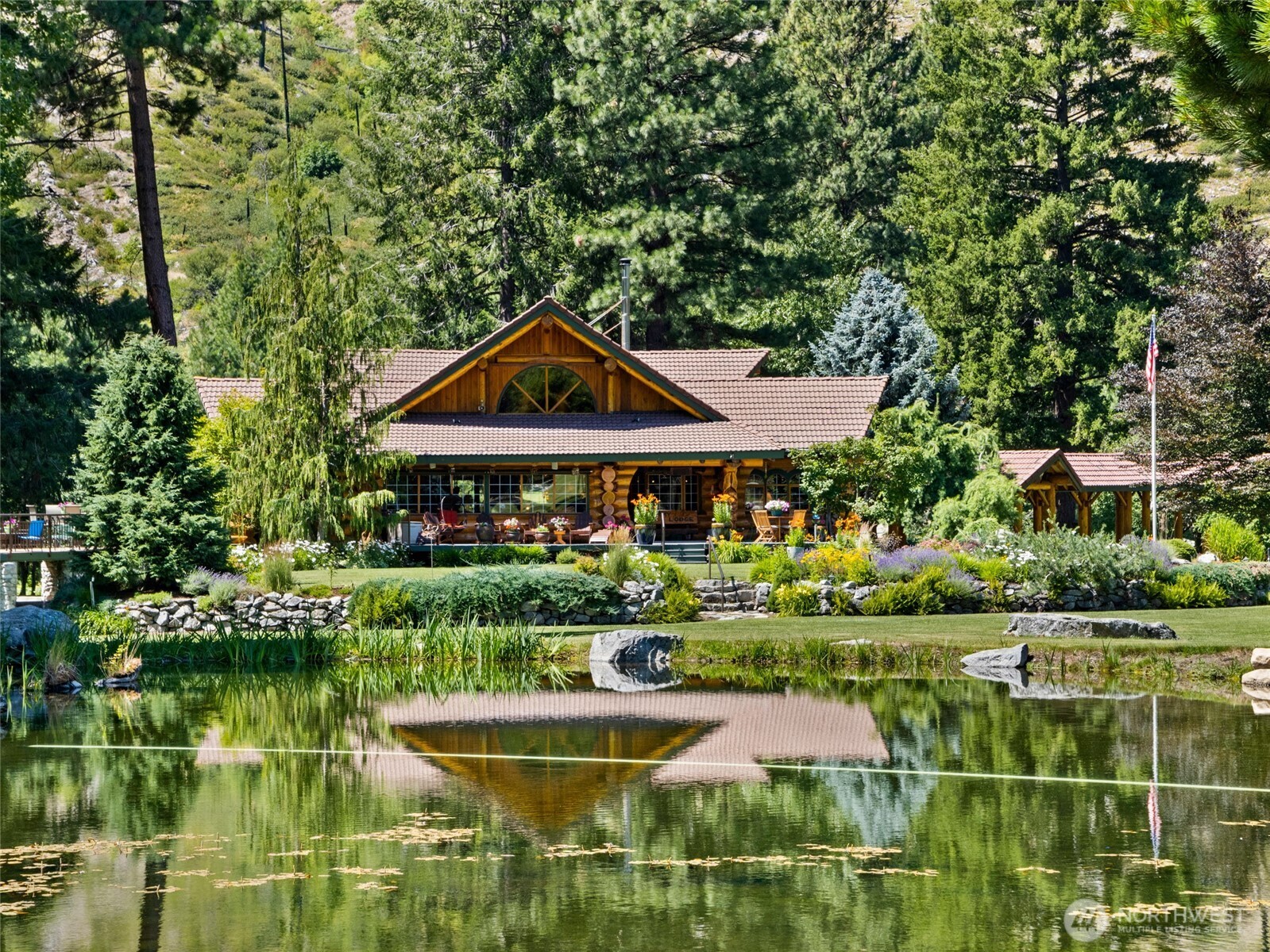 13537 Entiat River Road Entiat, WA 98822 - Photo 33 of 40 a front view of a house with a yard table and chairs