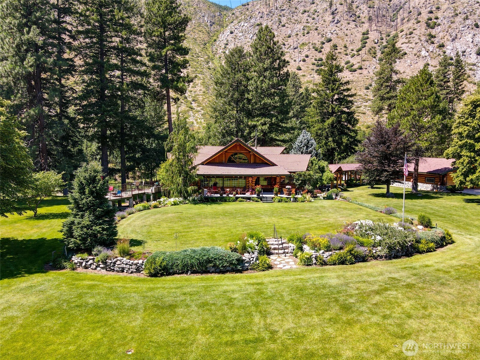 13537 Entiat River Road Entiat, WA 98822 - Photo 34 of 40 a view of a house with a big yard and large trees