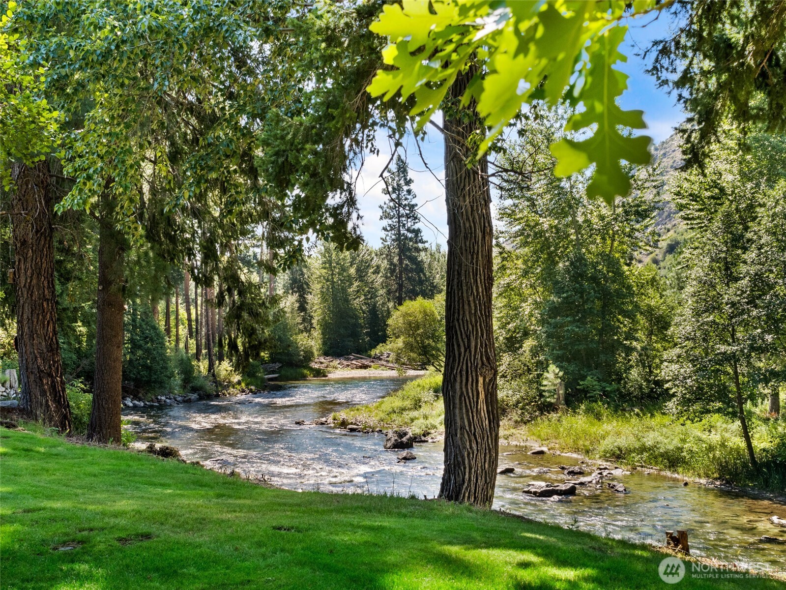 13537 Entiat River Road Entiat, WA 98822 - Photo 36 of 40 a view of a backyard with large tree