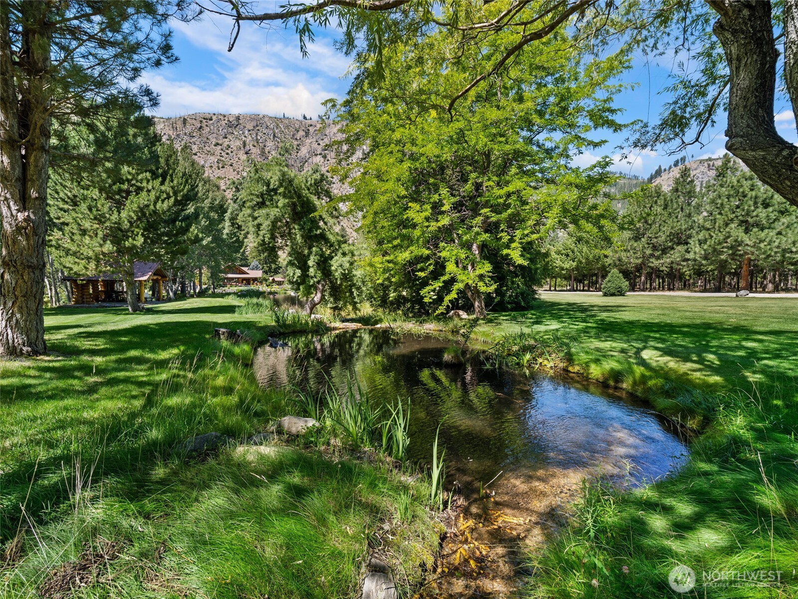 13537 Entiat River Road Entiat, WA 98822 - Photo 38 of 40 a backyard of a house with a yard and outdoor seating