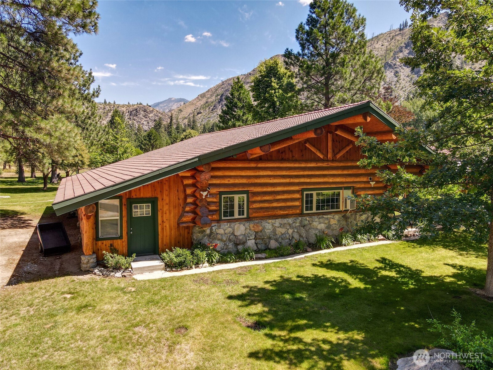 13537 Entiat River Road Entiat, WA 98822 - Photo 4 of 40 a front view of house with yard and trees around