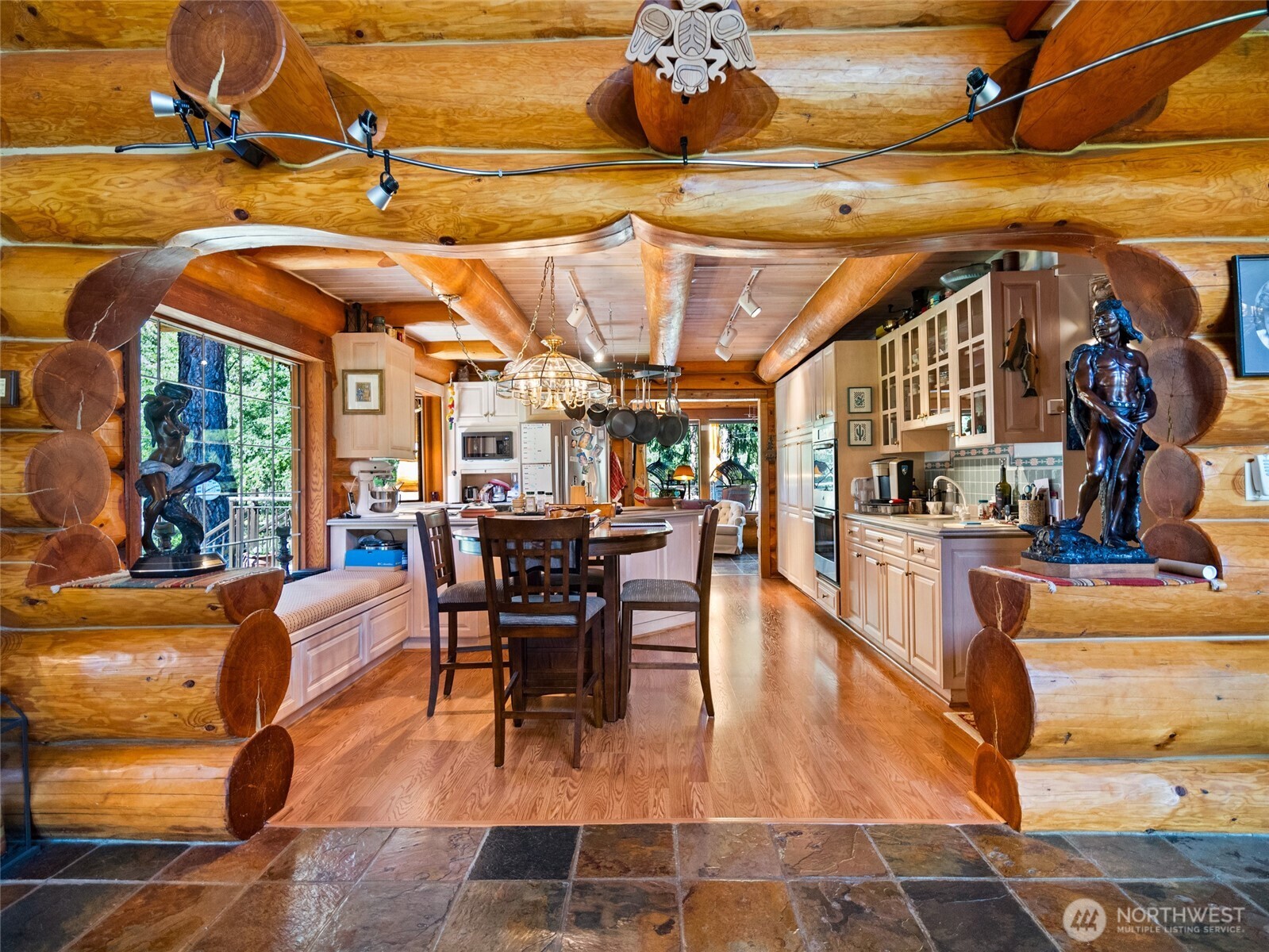 13537 Entiat River Road Entiat, WA 98822 - Photo 7 of 40 a view of a patio with dining table and chairs with wooden floor