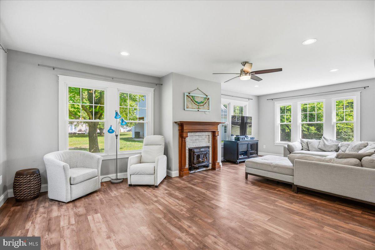 16146 Thomas Road Piney Point, MD 20674 - Photo 26 of 70 a living room with furniture and a fireplace