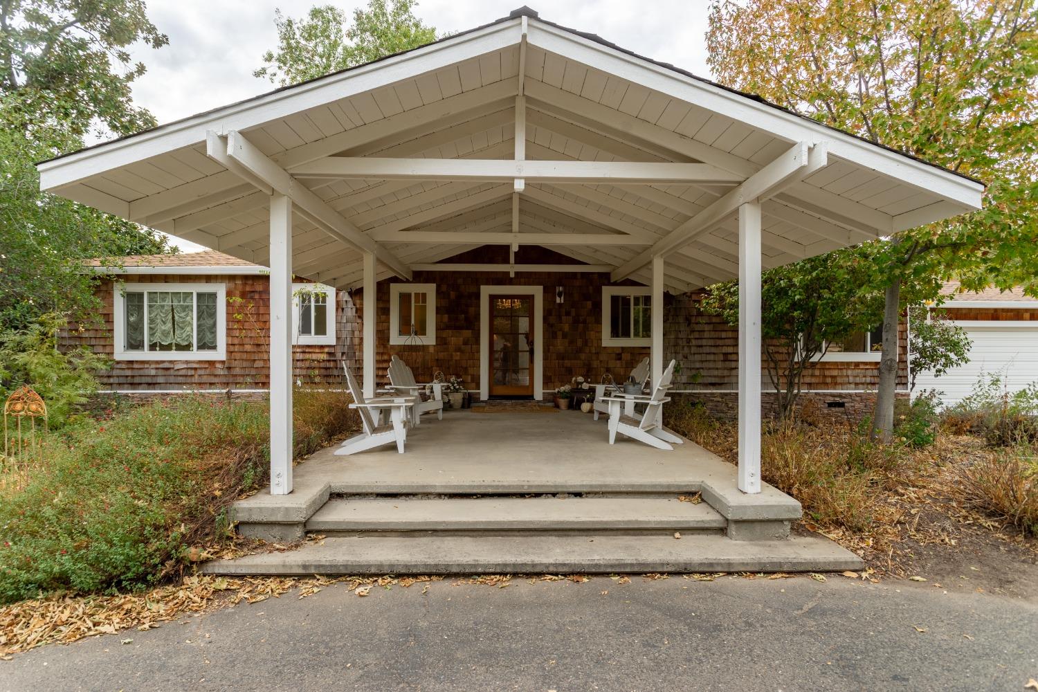 8100 Barton Road Granite Bay, CA 95746 - Photo 1 of 1 a view of a house with backyard and porch