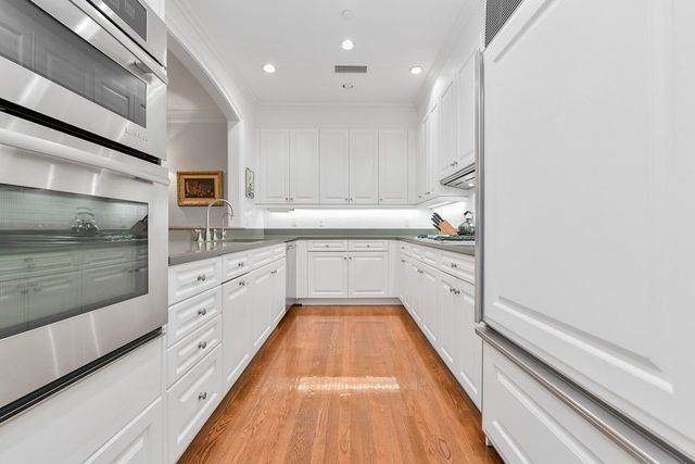 a large kitchen with cabinets