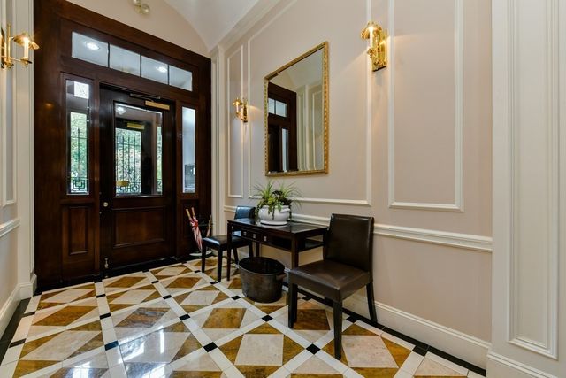 a view of a dining room with a table and chairs
