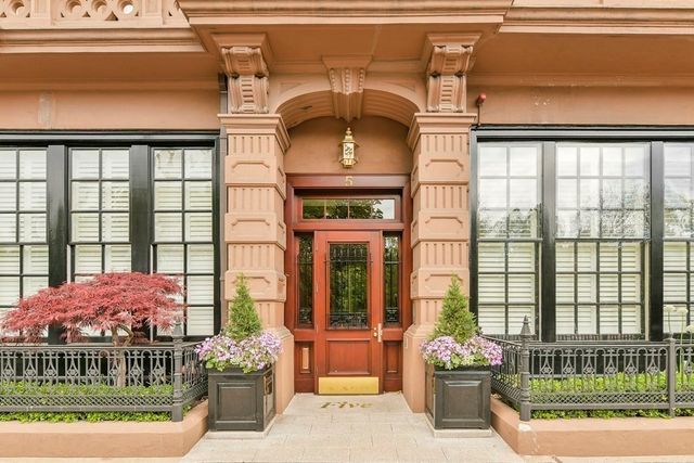 a front view of a house with a porch
