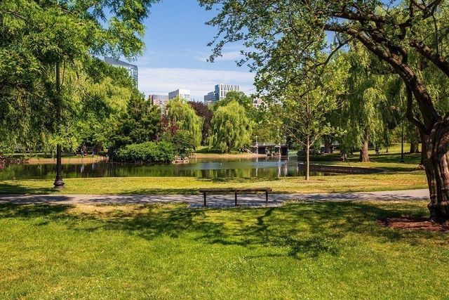 a view of a swimming pool with an outdoor space and seating area