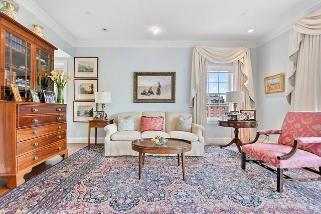 a living room with furniture and a rug