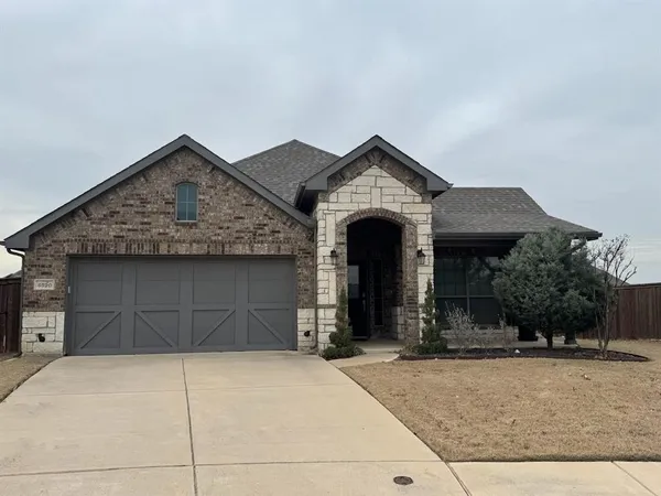 a front view of a house with yard