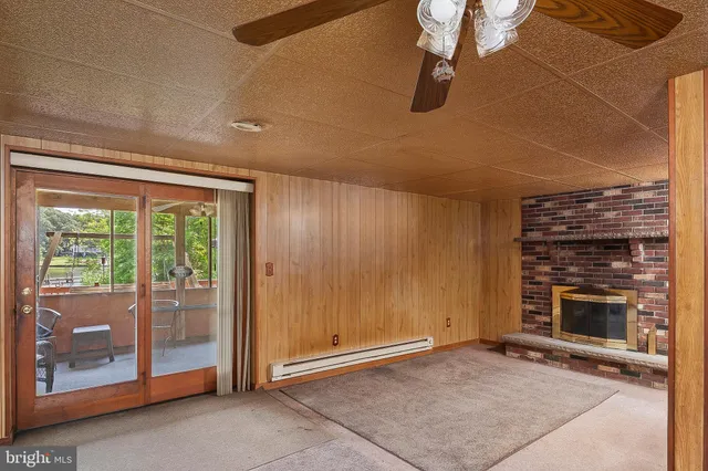 a view of an empty room with a fireplace