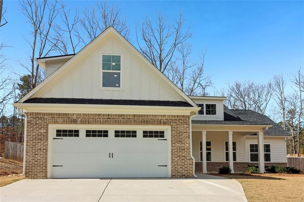 a front view of a house with a garage